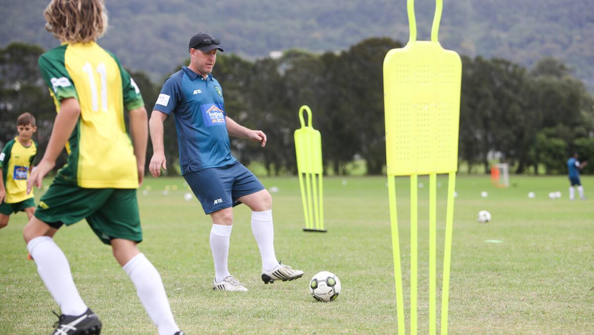 CHIPPERS' BLUEPRINT: Former Socceroo Scott Chipperfield, pictured here running a coaching clinic for kids at Holy Spirit College in Bellambi in April this year, gives us his tactics he feels Australia should use at the World Cup. Picture: Adam McLean
