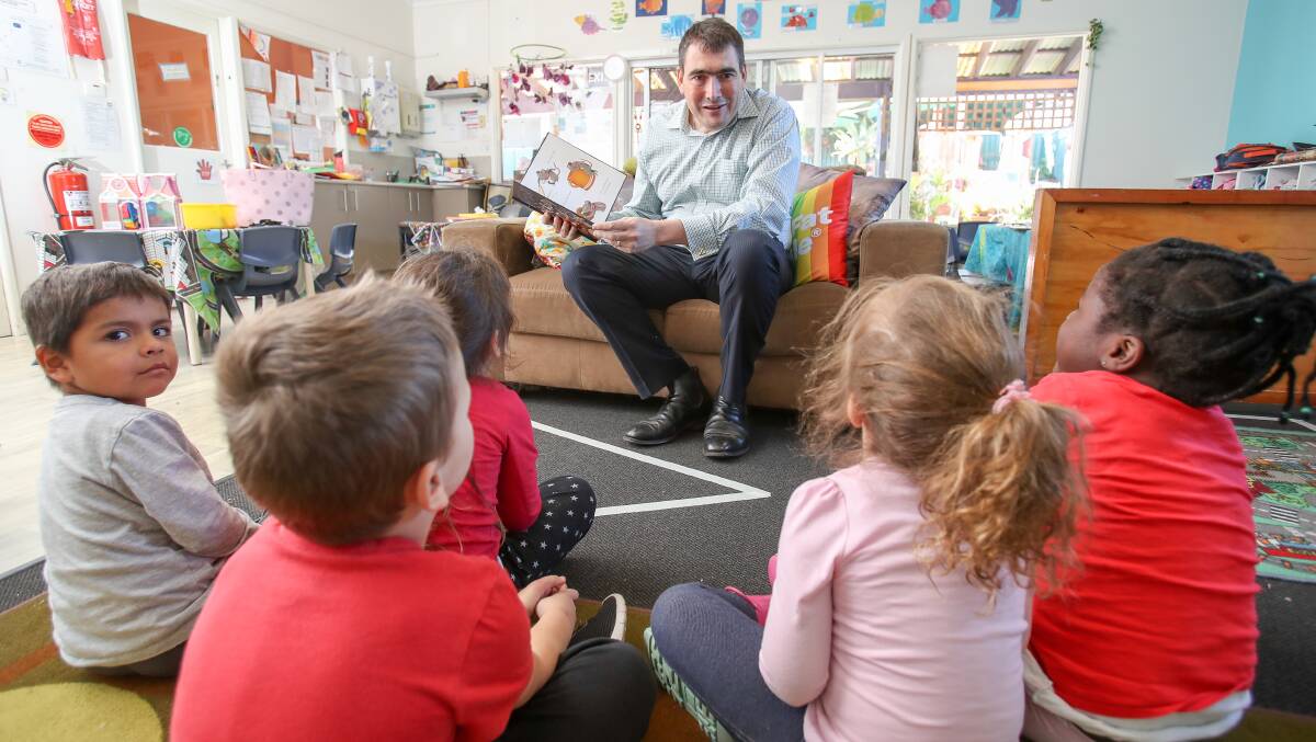 STORY TIME: Big Fat Smile's Ben Marsh reads to Warrawong Community Preschool children during the National Simultaneous Storytime on Wednesday, May 23. Picture: Adam McLean