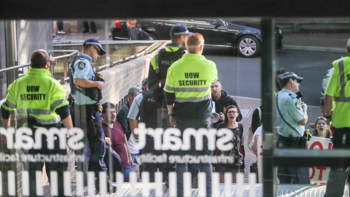 STUDENT PROTEST: Police and security keep out student protesters at UOW on Wednesday afternoon during a visit by the Minister. Picture: Adam McLean.