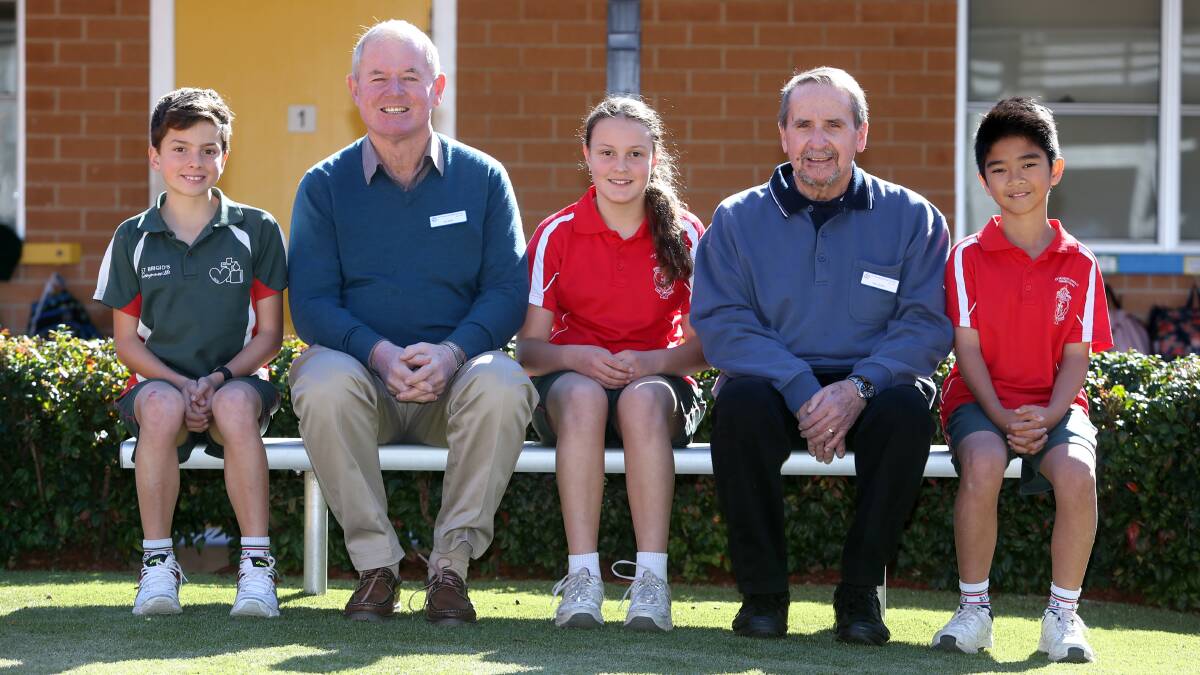 DIGGING DEEP FOR VINNIES: Peter Cooney and Michael Tobin from St Vincent de Paul with St Brigid's Catholic Parish Primary School students Henry Jones, Emily Muzevic and Matthew Jornales. Picture: Robert Peet