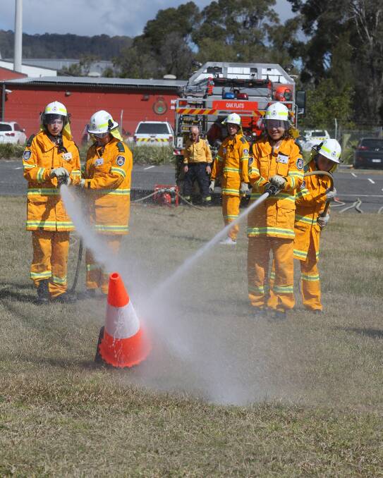 NEW CADETS: Lake Illawarra High School students Jakob Lawrence, Tahni Anger, Dylan Rooze, Damien Riggs and Caieta Bazzano during the fire drills. Picture: Robert Peet
