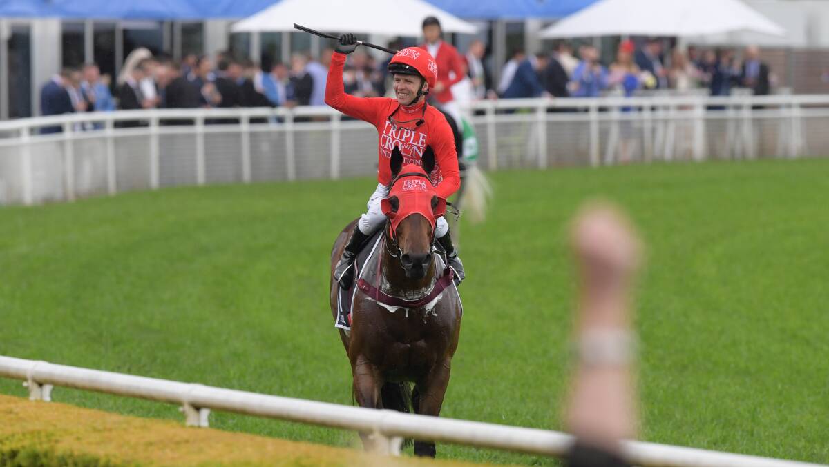 BACK-TO-BACK: Jockey Kerrin McEvoy returns to scale after riding Redzel to victory. Picture: AAP Image/Simon Bullard