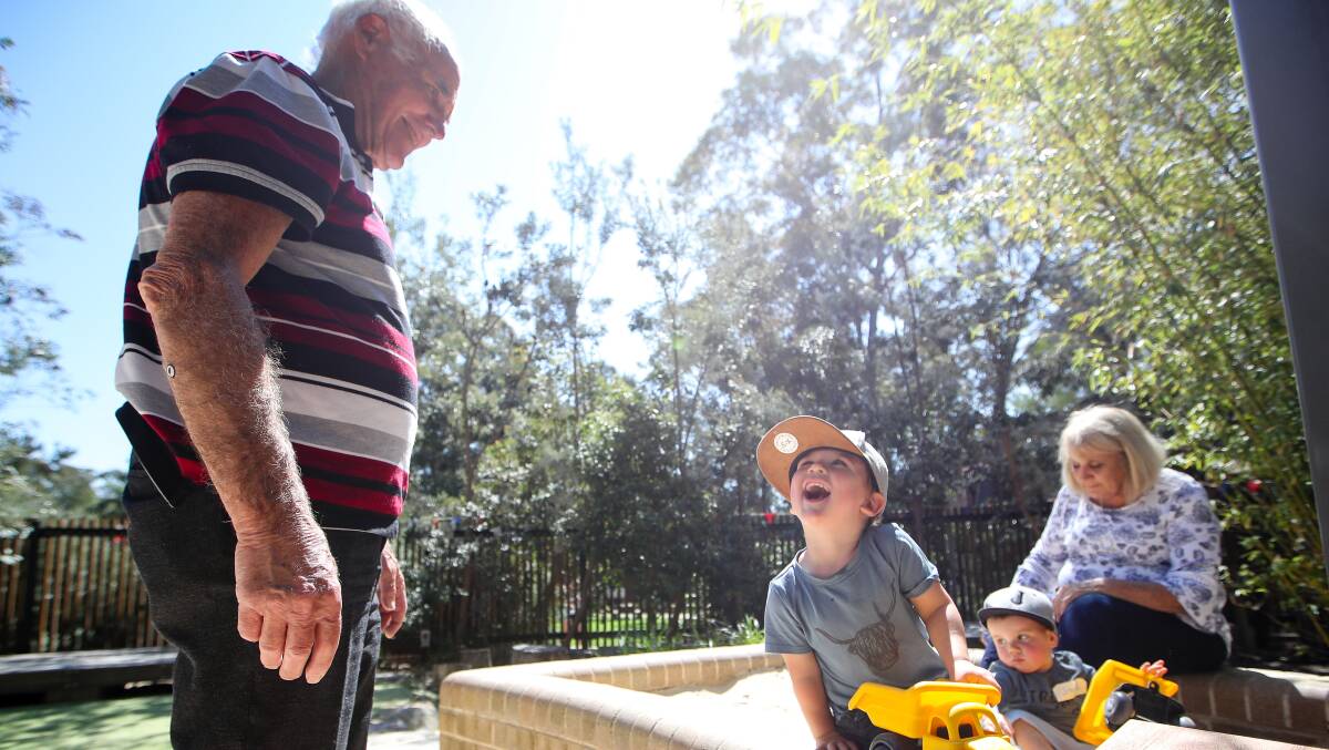 Ken Faulkner joins great grandsons Eli Rankin and Jack Ranking and his daughter Karen Newman at the Early Starts Playful Learning Space at UOW on Wednesday. Picture: Adam McLean.