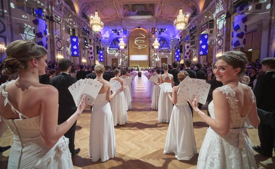 BALL BELLES: Beautiful white-gowned debutantes and dashing young men in perfectly pressed tuxedos. Photos: Vienna Tourism