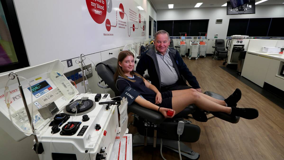 Saving lives: Corrimal resident Phillip Murray with his granddaughter Brittney Zulian, 18, who donated blood on his behalf last Wednesday. Picture: Sylvia Liber