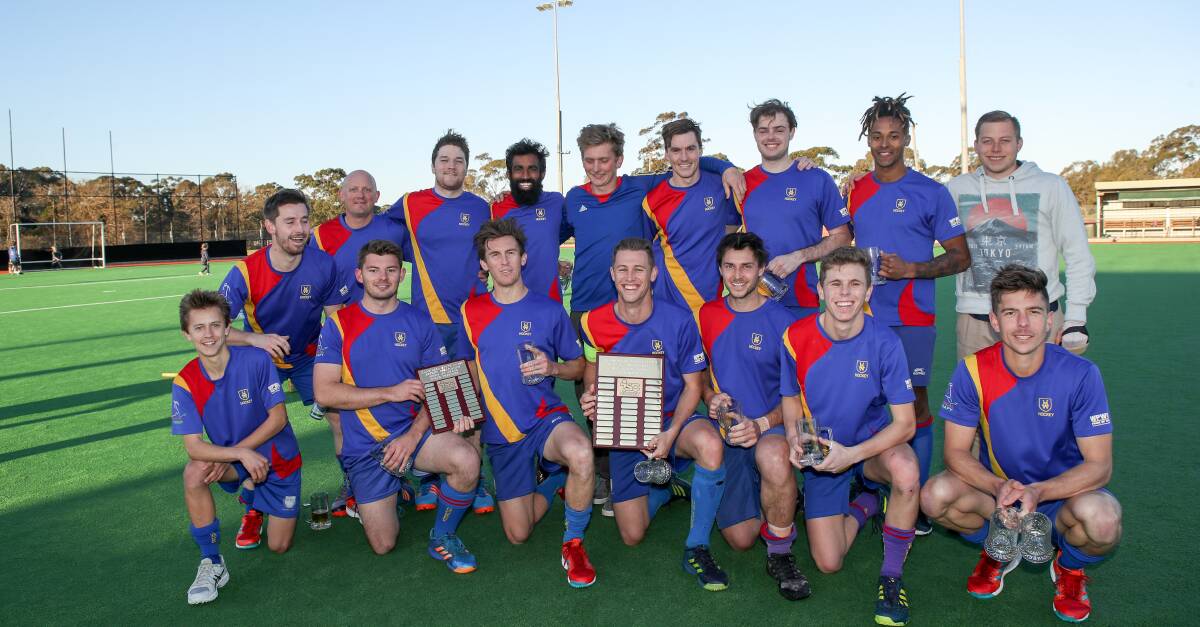 Hockey premiers: University team members celebrate after taking out the 2018 Illawarra Hockey grand final at Unanderra Hockey fields on Sunday. Picture: Adam McLean.