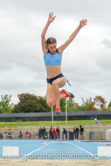 High flyer: Delta Amidzovski breaking the Australian record in long jump 5.49 metres. Picture: Courtesy www.sportstrendphoto.com.au. 