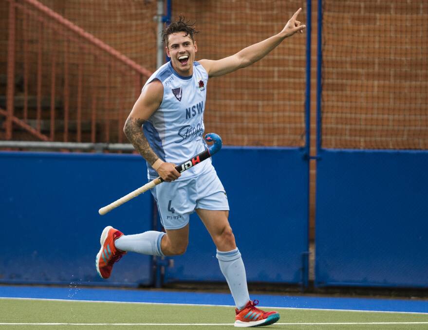 Swapping blue for green and gold: Jack Hayes celebrates scoring a goal for NSW Waratahs against Canberra Lakers last month. Photo: Dion Georgopoulos