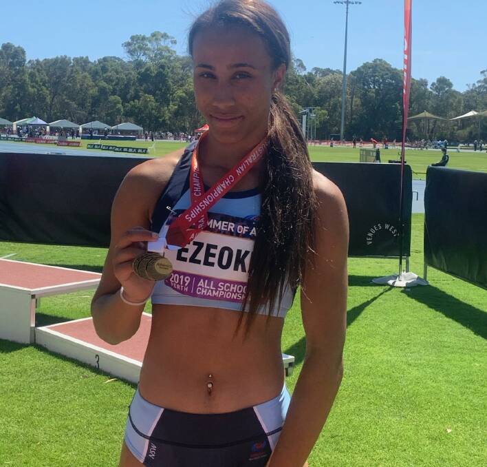 Blistering form: Chelsea Ezeoke displays her gold medal after taking out the Australian All Schools Under 14 girls' 400m.