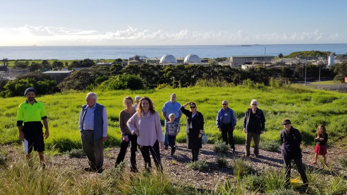 Park project: Park co-ordinator Johnny Alevras leading a group of Rotarians and visitors to the site of last year's National Tree Day planting at the peak of Greenhouse Park overlooking Port Kembla.