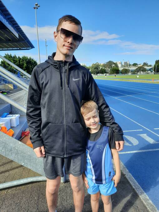 Senior IBS athlete Cory buddies up with one of the club's youngest members Joseph, showing that the club caters for all ages at the same venue at the same time - ideal family participation.