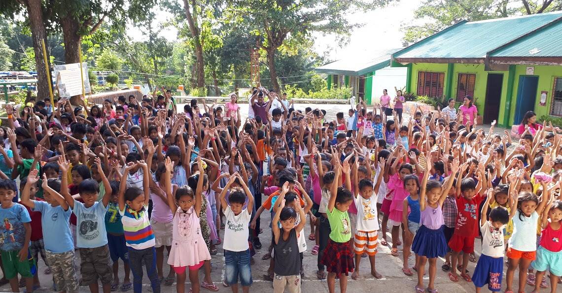 International aid: Some of the many hundreds of children who received food and medical help thanks to Rotary's international project in the Philippines.