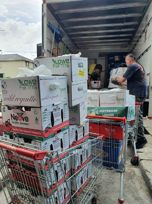 DONATION: The Fraternity Club has come to the rescue of the Wollongong Homeless Hub by donating crates of milk and boxes of food to assist families in need.