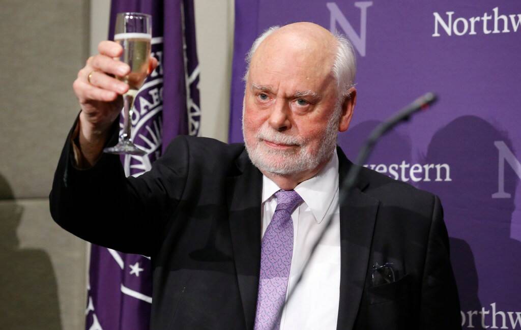 Northwestern professor Sir Fraser Stoddart toasts his Nobel prize in chemistry award. Picture: AP