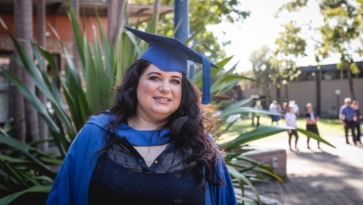 INSPIRATIONAL: A brain injury did not stop Elizabeth Baxa from achieving her dream of graduating with a Bachelor of Communication and Media Studies degree. Picture: Paul Jones.