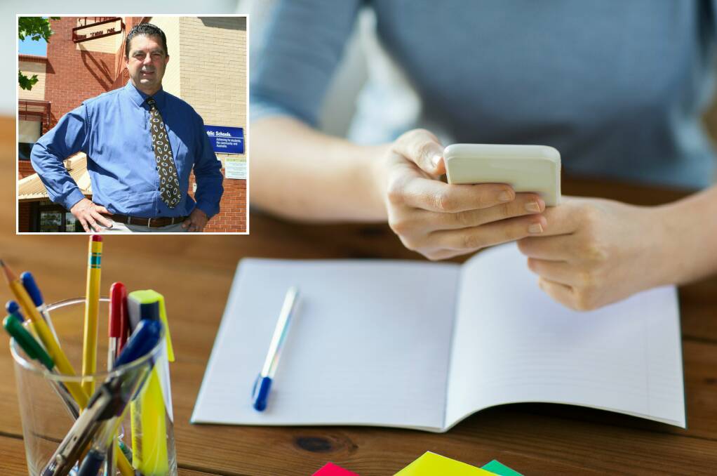 SCHOOL SMARTPHONES REVIEW: NSW Secondary Principals Council president Chris Presland (inset) believes banning smartphones in schools will not stop the problem of bullying.