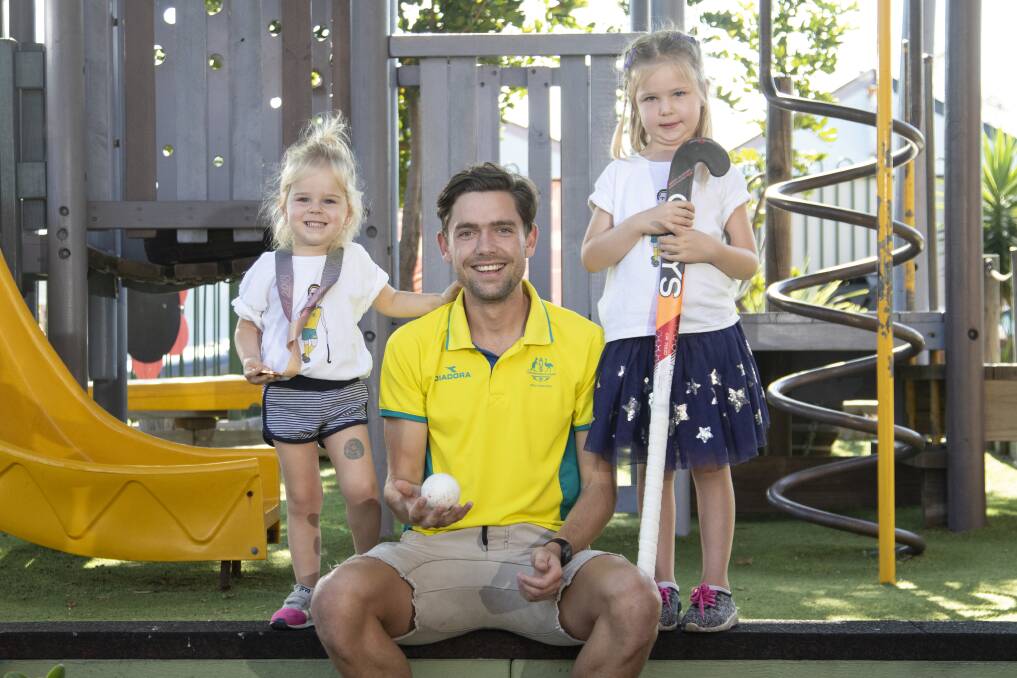 BACK HOME: Australian hockey player Flynn Ogilvie chilling with his nieces Neve and Isla Scerri at Port Kembla Community Preschool.