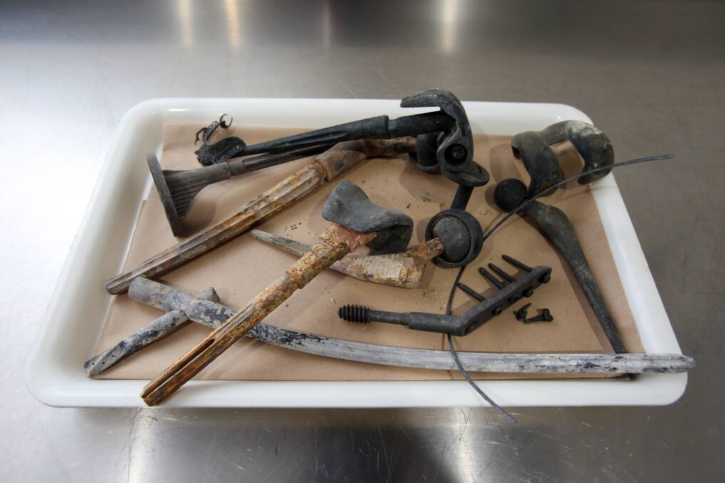 Metal orthotics that have been extracted from the cremains after the cremation process at the Unanderra site. According to management, they are disposed of and recycled in "an appropriate manner". Picture: Robert Peet