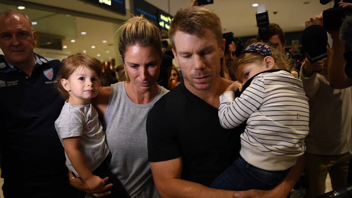Former Australian cricket vice-captain David Warner arrives with his wife Candice and their children at Sydney International Airport on Thursday. Photo: AAP