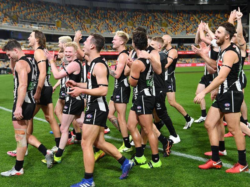 Collingwood players celebrated their first win in three AFL games after they accounted for Sydney.