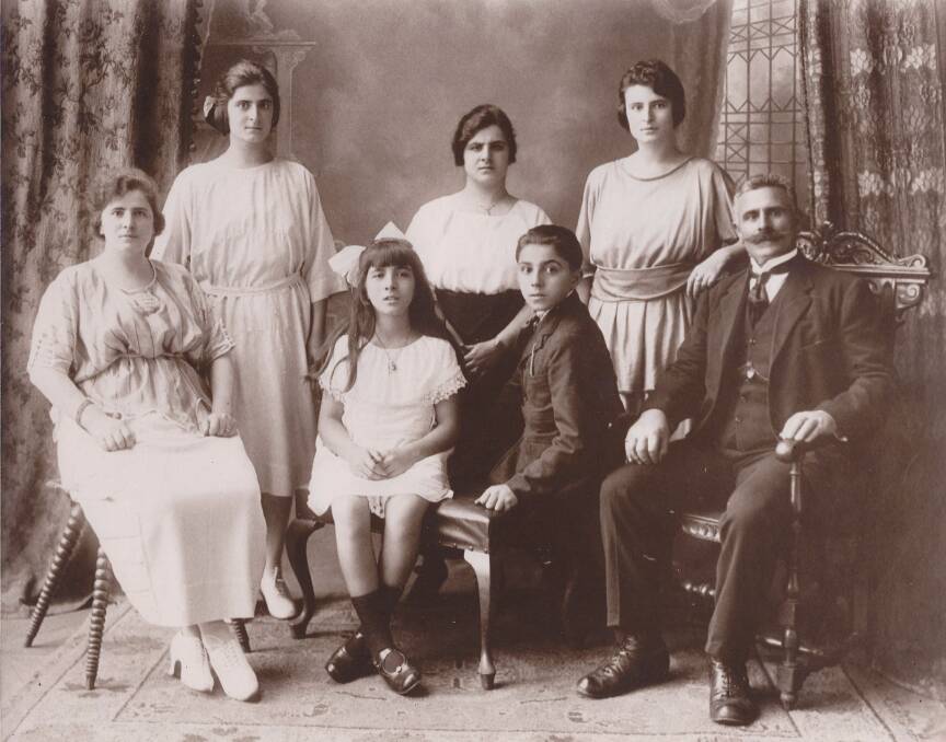 Sixteen-year-old Vincent Arena died on February 4, 1926. He is pictured with his family.