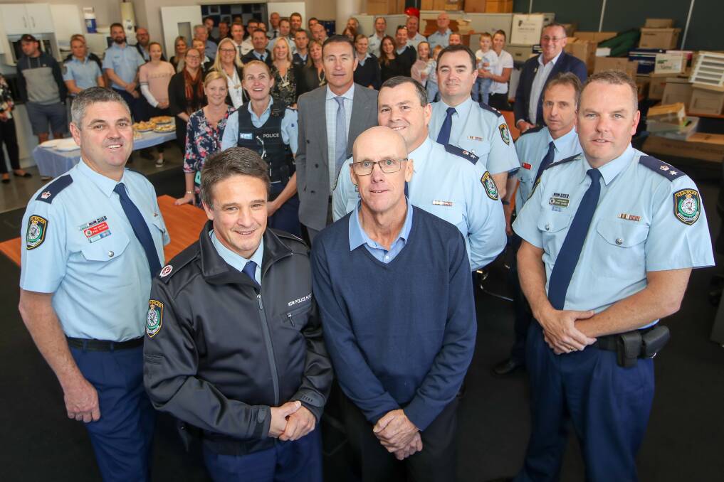 Goodbye: Senior Constable Anthony Riordan (centre) is farewelled at Wollongong Police Station on Thursday morning. Picture: Adam McLean.
