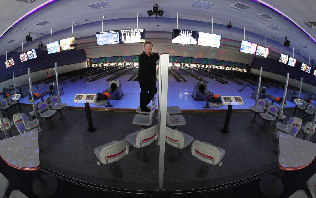 Sandii Hughes with the new screens between lanes at Northern Bowl. Picture: Robert Peet

