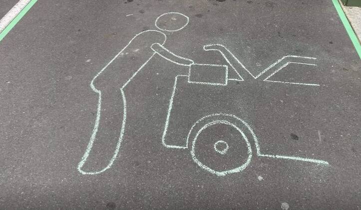 Simple idea: The chalk drawing at North Wollongong that Dan Murphy's is now painting on its direct-to-boot service parking bays around Australia.
