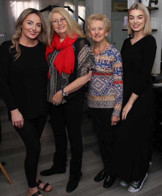 Golden anniversary: Karen White (second left) celebrates her 50th year at Hair Establishment with Nikki Pagett, Pam Binstadt and Brooke Mitchell. Picture: Greg Ellis. 