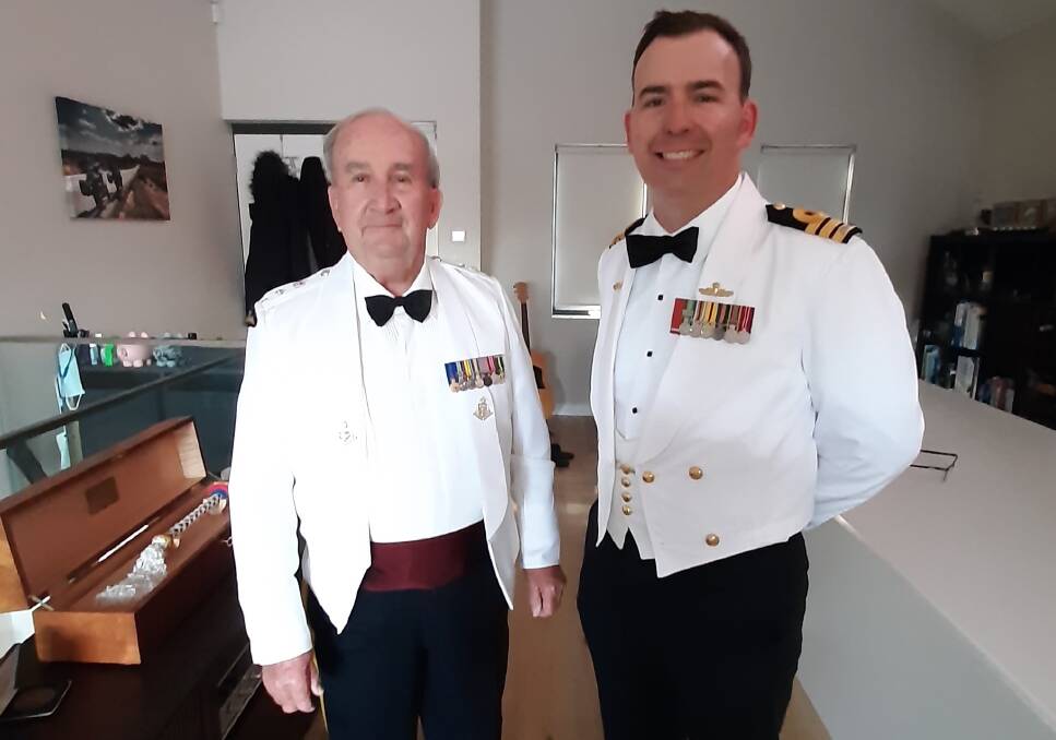 Prof Michael Hough and his son Commander Andrew Hough of the Royal Australian Navy in summer mess dress at the Royal Australian Armoured Corps Cambrai Day Dinner recently.