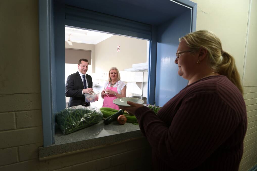 Food need never greater: Member for Wollongong Paul Scully and Warrawong Community Centre's Maxyne Graham welcome new state government funding for important lunch program. Picture: Sylvia Liber. 