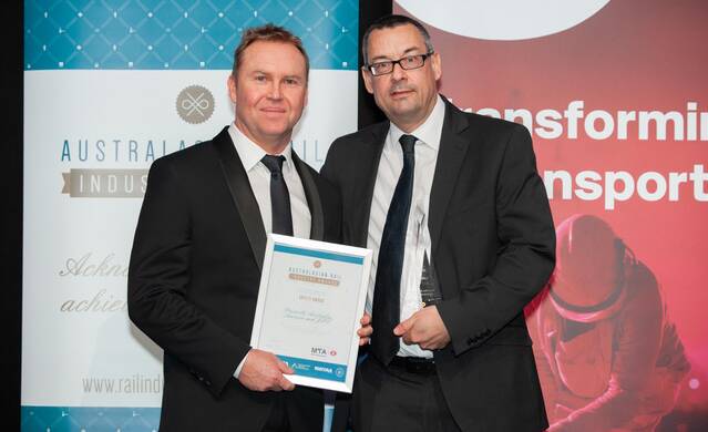 National win: Prescribe Australia Safe 2 Handle specialist Haydn Tawse with Metro Trains Australia and its business operations executive director Jason Westwood at the awards in Sydney.

