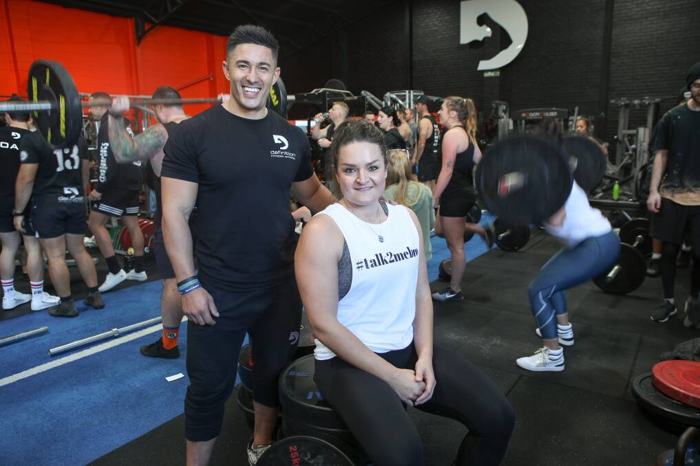 On a mission: Daniel Knust, of Definition Fitness, with #talk2mebro founder Kristy Hajjar during the hour long challenge to lift one million kilos for suicide prevention. Picture: Adam McLean. 
