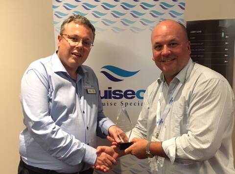 National win: Cruiseco national sales manager Greg Wilson presents the National Top Performing Agent Award to Travel on Crown's Jonathan Hickman. 