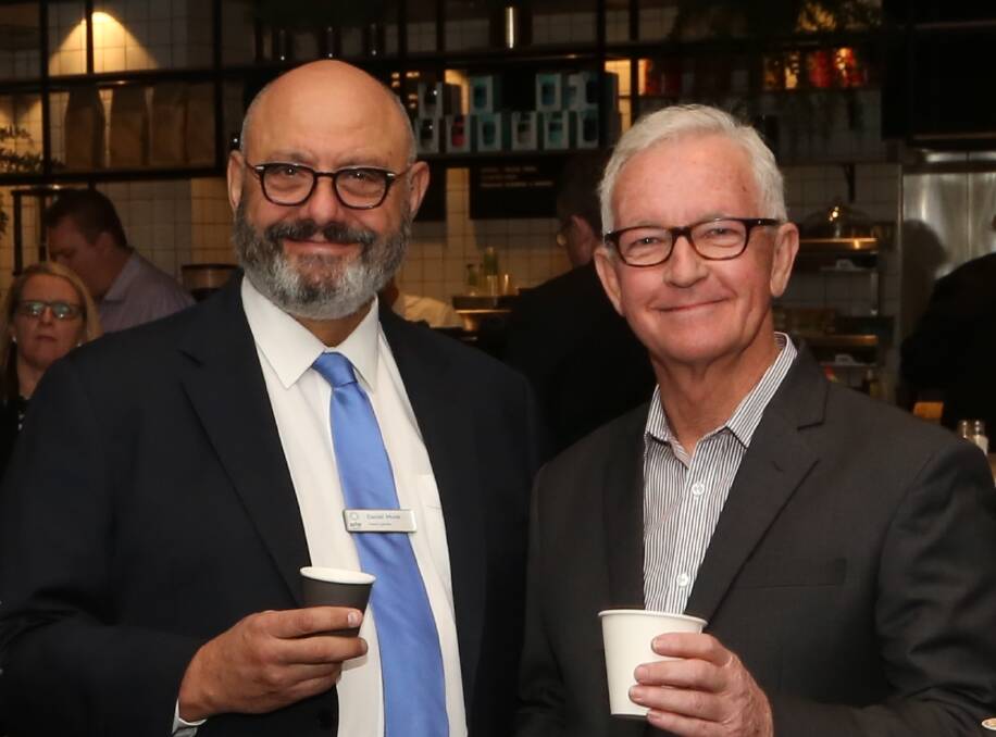 Helping the homeless: Aster Group's Daniel Munk and Flagstaff Group's Roy Rogers at the Coffee Day at Wests Illawarra for the Vinnies CEO Sleepout. Pic: Greg Ellis.




