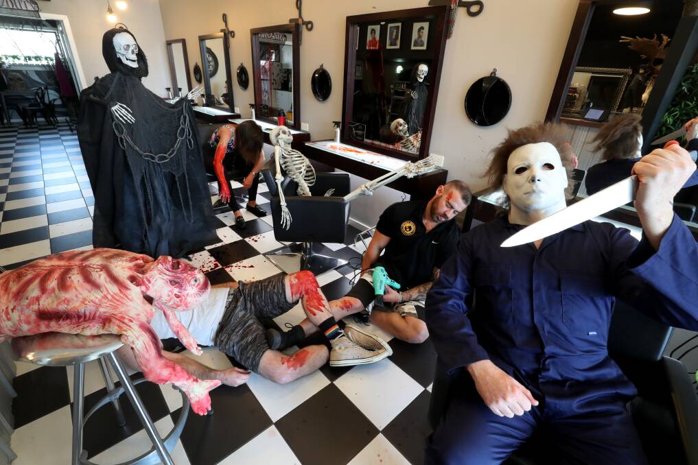 Halloween: Port Kembla hairdresser Kevin Crane dressed up as Michael Myers from the movie Halloween last year but is keeping his plans for this year a mystery. Picture. Robert Peet. BELOW Other Kevin Crane Halloween outfits.