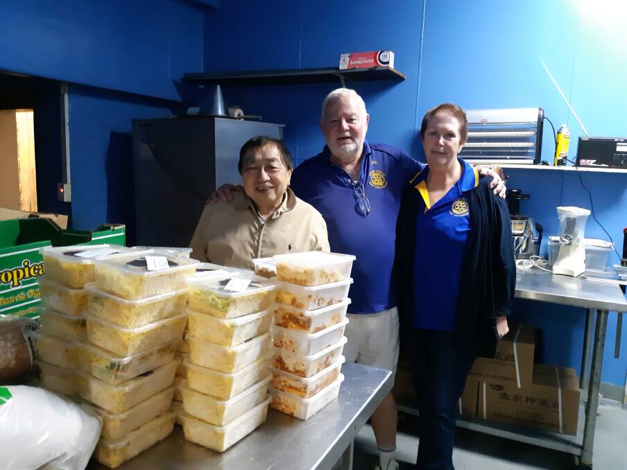 Generous community: Jim and Anne Christensen deliver frozen meals from Harry Hunt to University of Wollongong.
