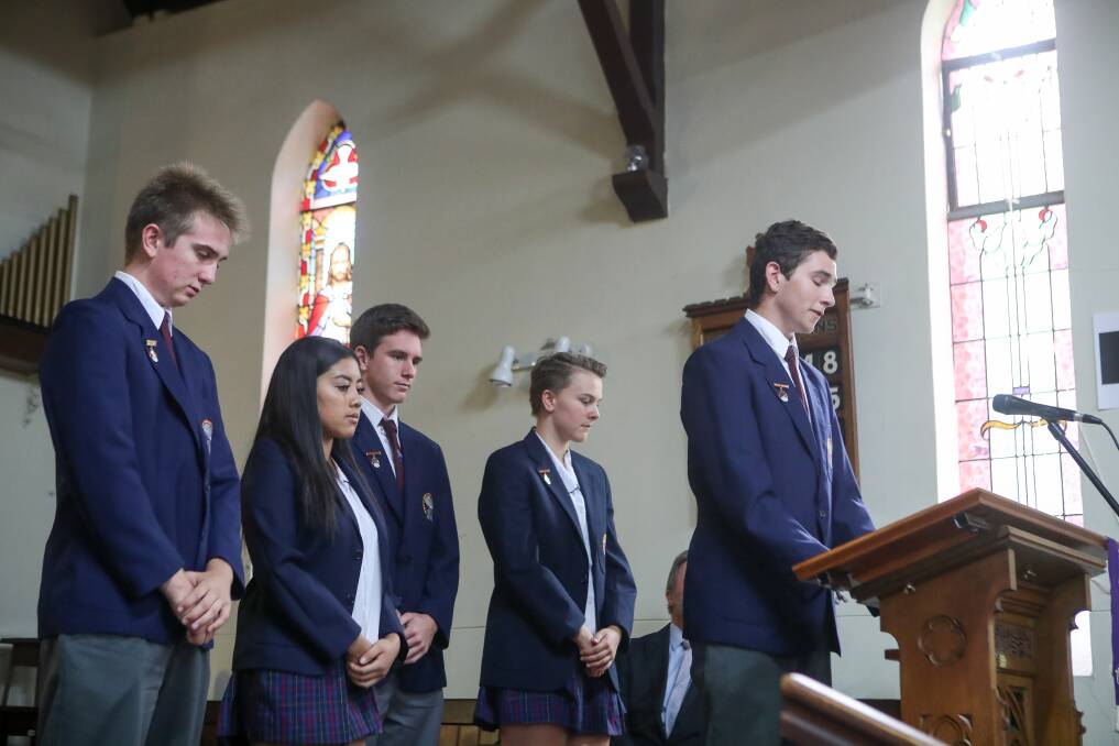 Moving moment: Bulli High School students read out the names of those who died.

