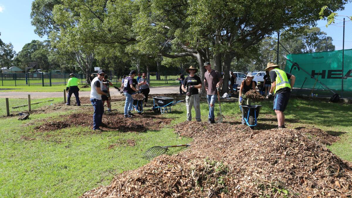 Helping the community: Volunteers work hard during Saturday's CityServe activity. Picture: Greg Ellis.