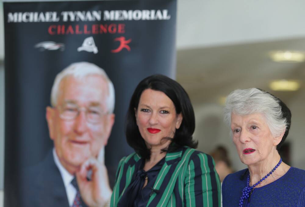 Business leader legacy: Madeline Tynan and Annette Tynan launch the 2019 Michael Tynan Memorial Challenge in front of an image of the late Mr Tynan who was the inspiration behind the event that supports medical research. 