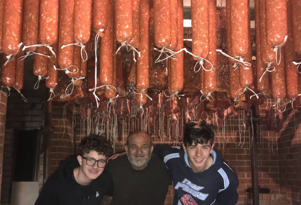 Keeping Italian tradition alive during COVID-19: Luigi Villella learned how to make salami in Italy when he was eight years old and on the weekend passed the tradition on to his 15 year old twin grandsons Anthony and Louis Villella. 
