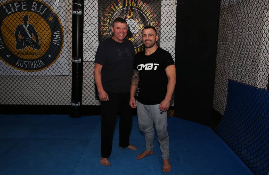Winning formula: Insight Security and Freestyle Fighting Gym owner and coach Joe Lopez with UFC title contendor Alex Volkanovski. Picture: Greg Ellis. 