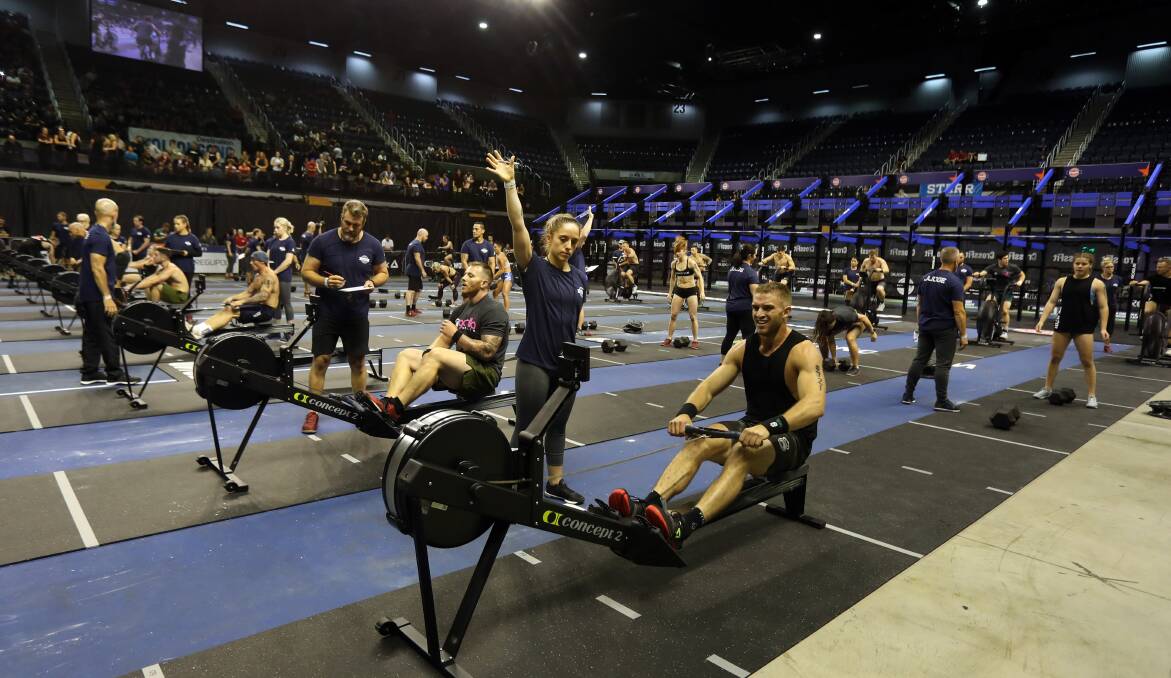 Working hard: CrossFit competitors in action at WIN Entertainment Centre on Saturday. Picture: Robert Peet
