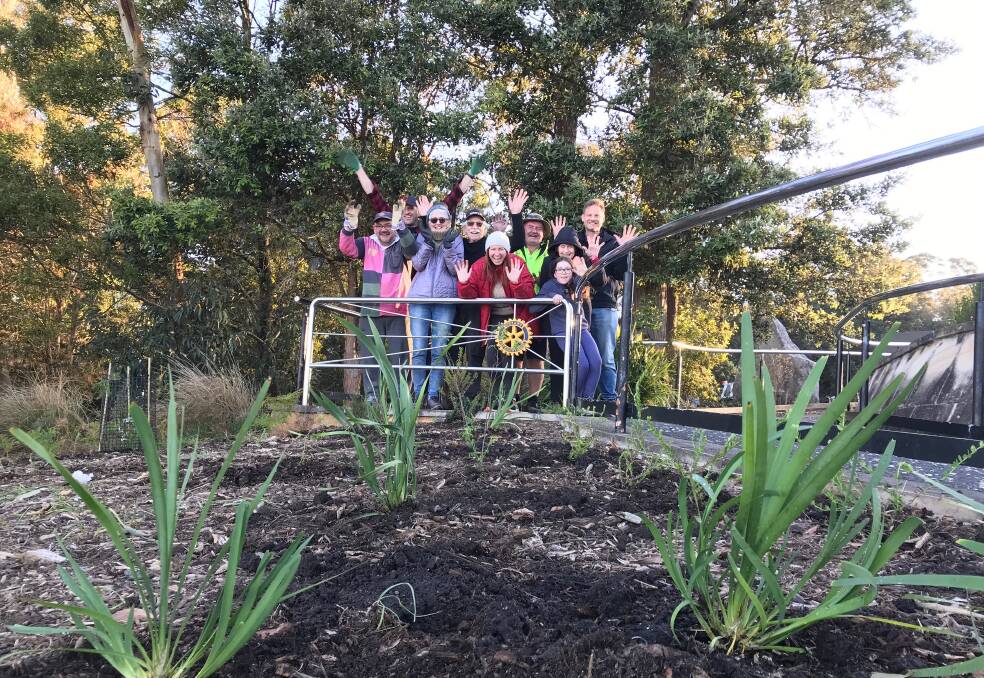 High ideals: Wollongong Rotary Club members and friends get together last week for the first of the club's summer working bees at Mt Keira's Summit Park.