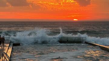 Sunrise at Austinmer Beach. Picture by Anthony Turner